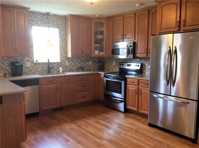 The sunlight from the kitchen window brightens the