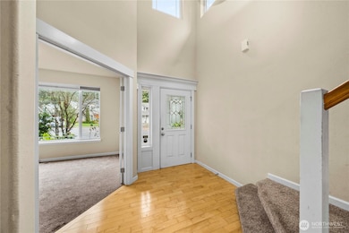 Hardwood floors from the entry to the kitchen.