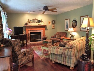 Family room complete with lovely hardwood and fire