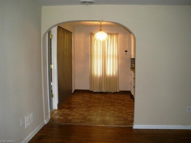 An architectural arched opening connects the eat-i