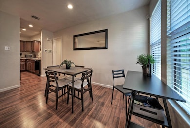 Dining room featuring healthy amount of natural l
