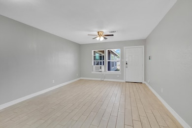 Bright and inviting living room with sleek tile fl