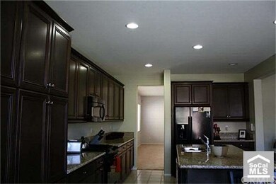 VIEW OF KITCHEN AND DINNING FROM BREAKFAST ROOM