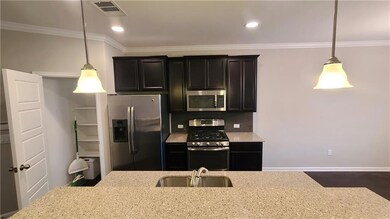 Kitchen with stainless steel appliances, light st