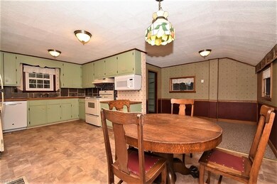 Large kitchen with eat in area and bonus area that