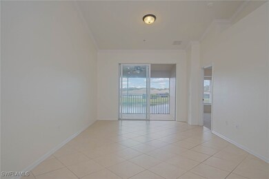 Unfurnished room featuring crown molding, light ti