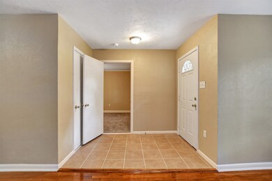 Coming in front door, to the right is the large Primary bedroom and in front is the coat closet