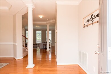 Hardwood floors run from the foyer and dining room