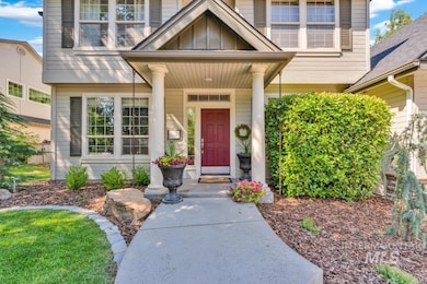 View of exterior entry featuring board and batten siding and a porch
