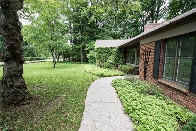 Full Of Charm With Flower Beds And Stamped Concret