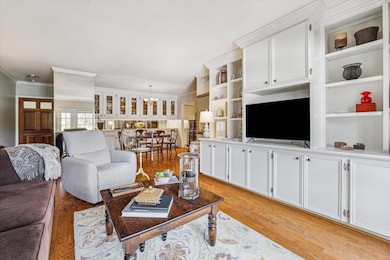 Den with custom bookshelves /cabinents