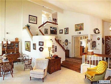 Dramatic staircase is a focal point of this great 
