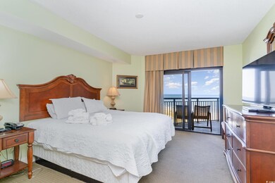 Carpeted bedroom featuring access to exterior