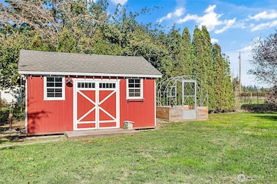 Outbuilding 1 has a manual awning. Greenhouse next to it just needs covering.
