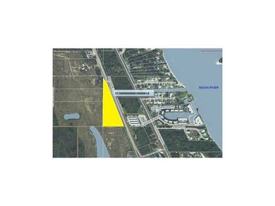 Aerial View. PARCEL OUTLINED & FILLED IN YELLOW.