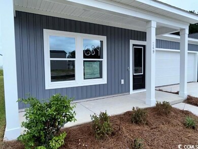 View of side of property featuring a garage