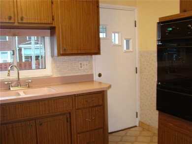 kitchen with walk-out to covered back porch and fe