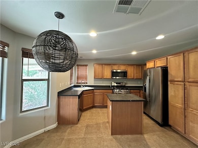 Kitchen with appliances with stainless steel finis
