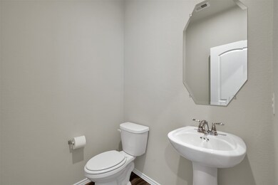 Spacious half bathroom downstairs for guests.  Note - there is now a beautiful accent wall.