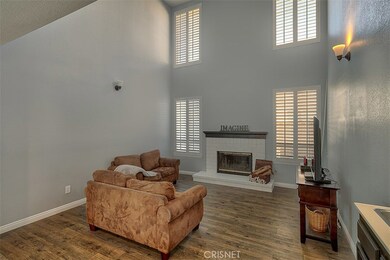 Living Room W/ High Celings and Fireplace