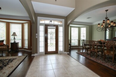 Beautiful Lead Glass Door with Blinds.  Formal Study/Living to the Left & Formal Dining to the Right.