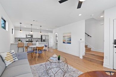 Living area with recessed lighting, stairs, light