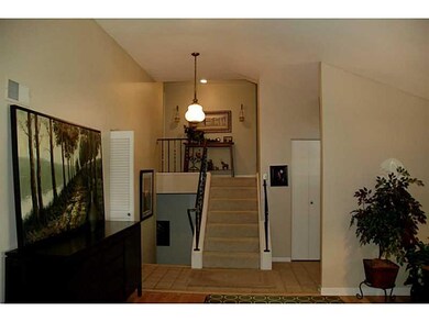 Entry/Foyer. Tile entry open to stairs up and down