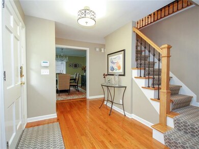 Gracious entryway-gorgeous hardwood floors and mol