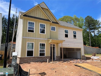 View of front of property with board and batten si