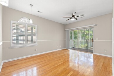 Spare room with a ceiling fan and wood finished floors