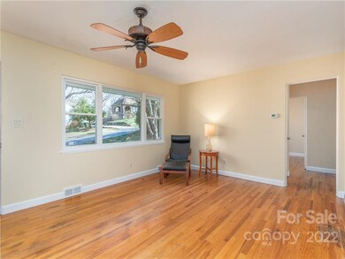 Original hardwood floors and large windows