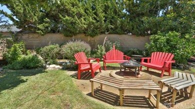 Beautiful Back yard with fire pit and waterfall wa
