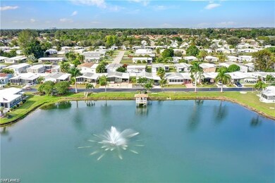 Birds eye view of property with a water view and a