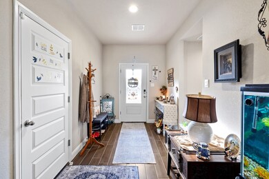 Entrance foyer featuring wood finish floors and recessed lighting