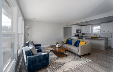 Living room is welcoming and spacious with tons of light!  The seller touched nearly every surface of this home over the last 5 months and made it beautiful!  