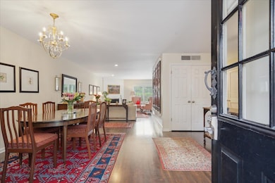 Dining room featuring a notable chandelier and har