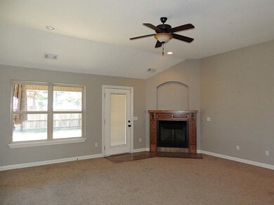 Living Room. Corner fireplace with built in niche
