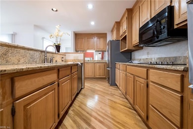 1305 Chesapeake Avenue, Hampton VA. Towards the back of the kitchen is a wet bar with sing