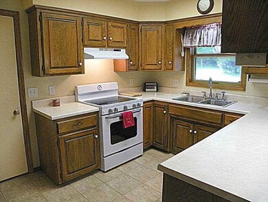 Kitchen. Well planned & sunny, this kitchen offers pull-out drawers, Pantry, Bosch Dishwasher, Lazy Susans.