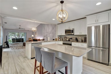 Kitchen with Island, Porcelain tile throughout Kit