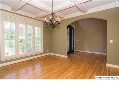 The dining room is bright and airy & opens to the 