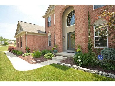 Exterior Front. Impressive entry w/professional landscaping & unique etched glass door.