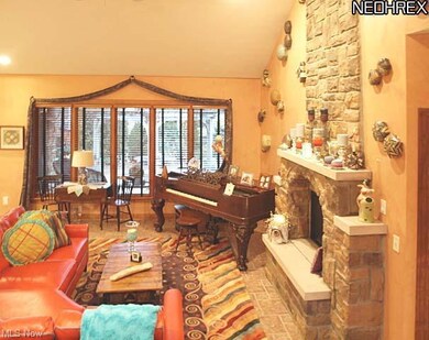 Great room with natural stone raised hearth gas fi