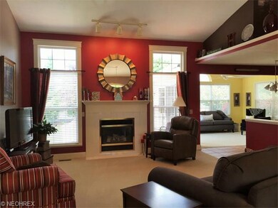 Great room with open floor plan to kitchen, sunroo