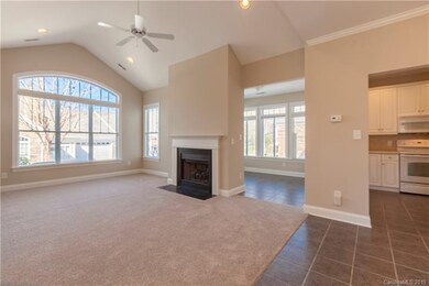Vaulted great room has gas fire place and new carp