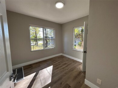Spare room with dark hardwood / wood-style flooring