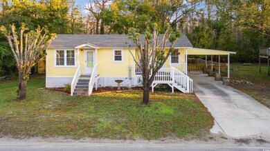 View of front of property featuring a front yard a