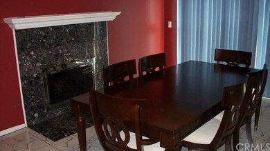 Formal Dining Room With Marble Fireplace