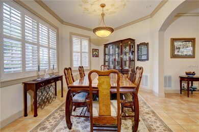 Dining room with custom painting ceiling accents