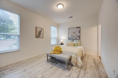 Bedroom featuring baseboards, wood finished floor